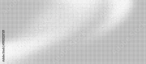 Halftone pattern with black dots on white background creating a gradient effect