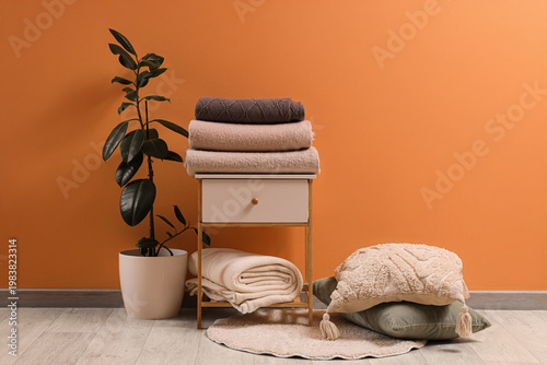 Bedside table with stack of...