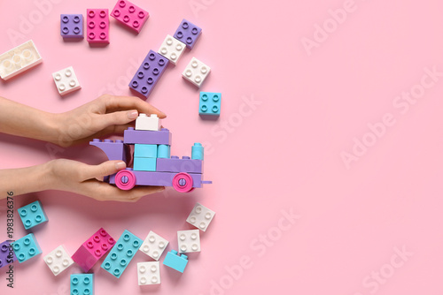 Female hands with toy car m...