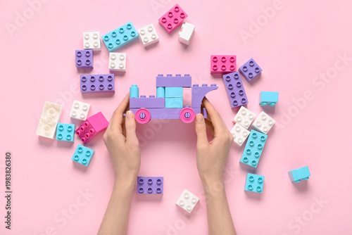 Female hands with toy car m...