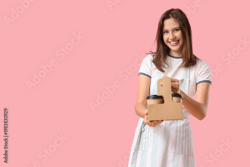 Happy young female barista ...