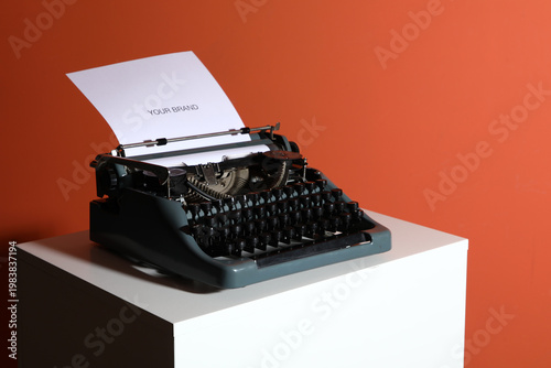 Vintage typewriter on pedes...