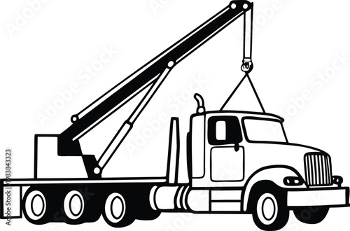 Tow truck with extendable crane arm lifting a large object