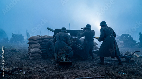 Foto Soldiers diligently manning an artillery gun on a muddy, misty battlefield during a historical war re-enactment