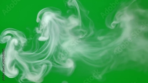 Soft white smoke gracefully swirling and flowing in the air, isolated on a vibrant pure green screen background, creating an elegant visual effect for various design projects and creative overlays