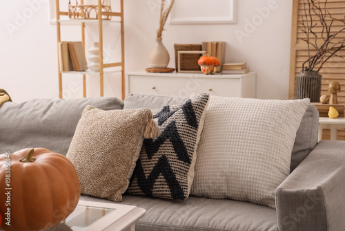 Grey sofa with cozy cushion...