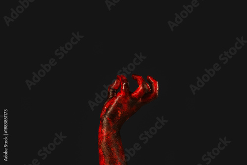 Fotografía Hand of zombie on black background. Halloween celebration