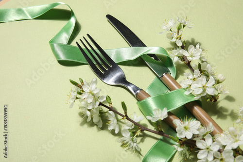 Silver cutlery with ribbon ...