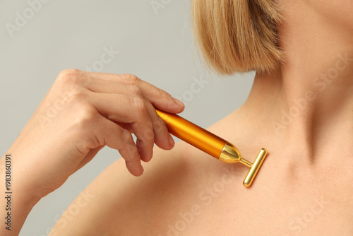 Woman with massage roller o...