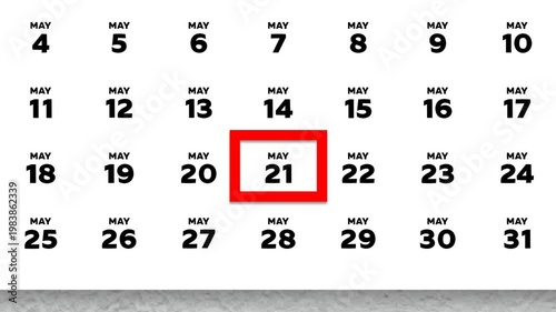 The date May 21st marked with a red cursor on the wall calendar 2026