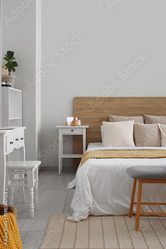 Interior of light bedroom w...