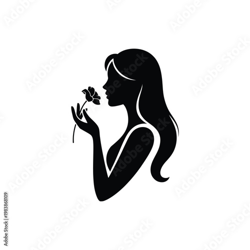 Black silhouette woman smelling flower