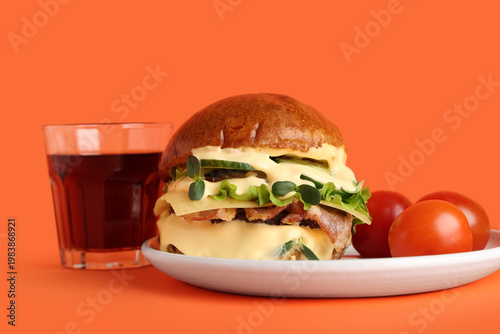 Plate with tasty burger, to...