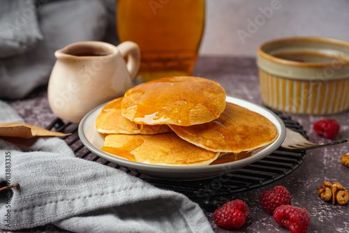 Plate of tasty pancakes wit...