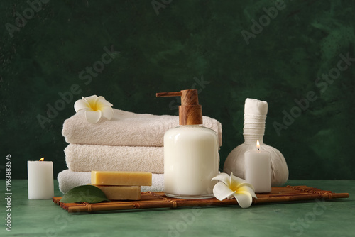 Set of spa supplies on gree...