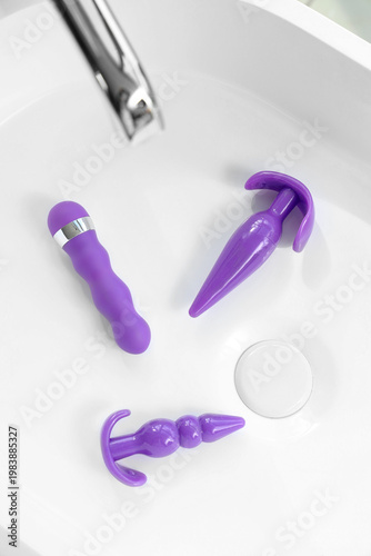 Sex toys in sink, top view