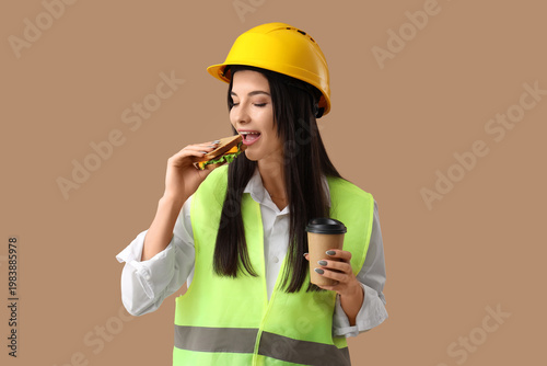 Female worker with cup of c...