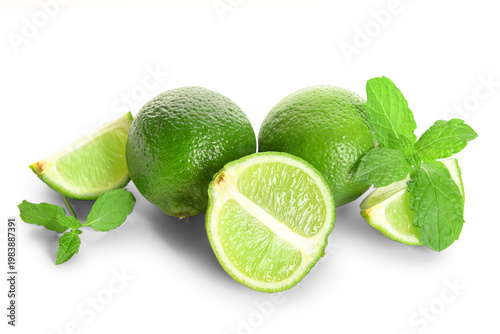 Fresh limes with mint on wh...