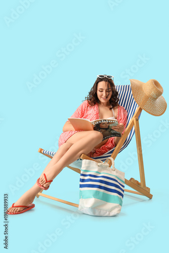 Young woman reading magazin...
