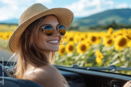 young woman in straw hat and sunglasses in a convertible gazing at a sunlit sunflower field on a bright summer road trip, feeling relaxed and carefree