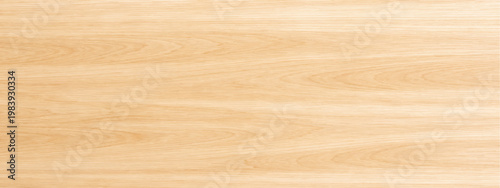 Abstract a detailed view of a light-colored wood surface, showcasing the natural grain and texture. This photo encapsulates the warm aesthetic and versatility of this natural material.