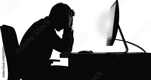Frustrated Man Sitting at Desk with Head in Hand in Front of Computer