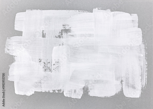 white acrylic paint brushstrokes on grey kraft paper. hand painted texture.