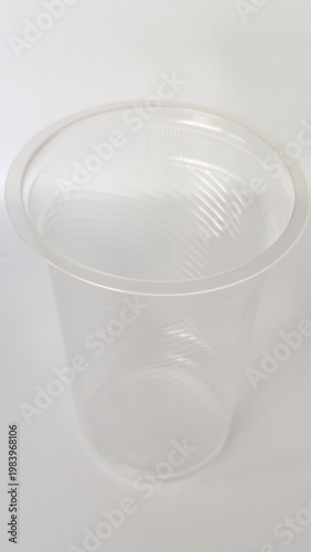Empty transparent plastic cup for cold drinks, disposable water glass vector.
