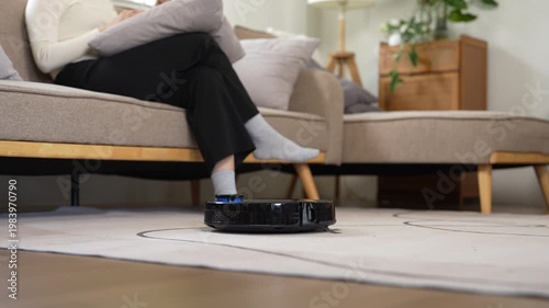 Cleaning room with modern wireless vacuum cleaner without cord.