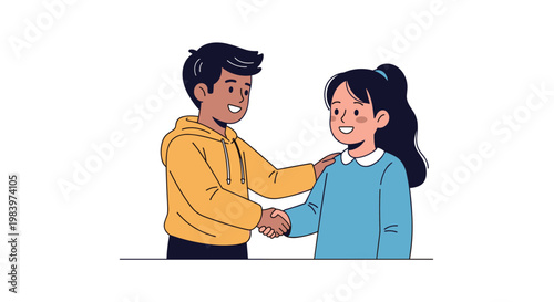 Friendly boy and girl shaking hands in a sign of agreement or friendship while wearing casual everyday clothing.