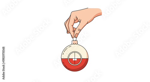 Human hand is shown holding a red and white christmas bauble ornament by its metal hook against a clean and minimalist white background.