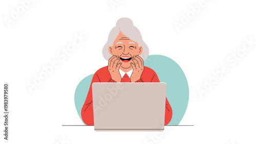 Happy elderly woman with gray hair laughs with joy while looking at her laptop screen, enjoying a video call or online content.