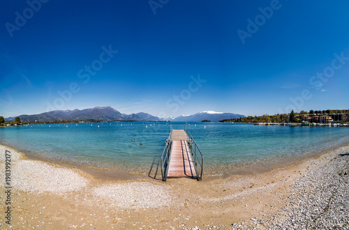 Visit to Lido di Manerba by Lago di Garda in Italy with clear water and mountain views