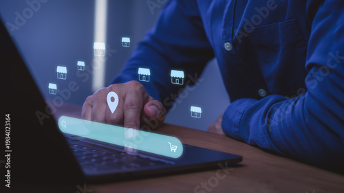 Fotografie Man using laptop with virtual search bar, location pin, and store icons