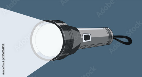 Powerful grey flashlight turned on emitting a bright beam of white light into the dark to show the way for exploration and safety themes.