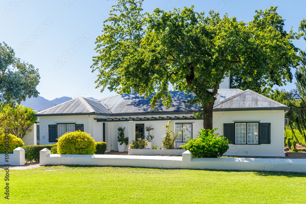 Fototapeta premium Winery house surrounded by lush greenery