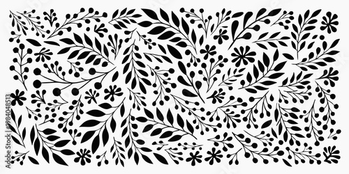 Intricate black and white floral pattern with leaves and delicate blossoms