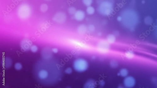 Abstract glowing purple and pink bokeh lights creating a dreamy and magical defocused background effect