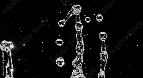 Slow motion glass of water splash with blue transparent liquid abstract time is money concept clean cold drink motion freeze frame