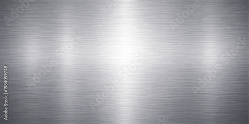 Polished silver stainless steel plate with a brushed metal texture and shiny industrial metallic surface pattern for a grey aluminum sheet background