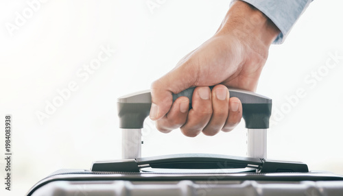 Hand luggage handle travel suitcase grip closeup holiday planning readiness hand gripping luggage handle suitcase during travel readiness and holiday planning, closeup detail for transportation