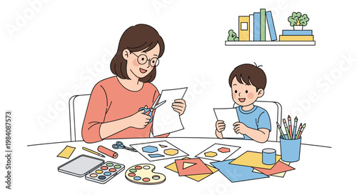 Smiling mother and her young son sit together at a table filled with art supplies while practicing paper cutting and crafting.