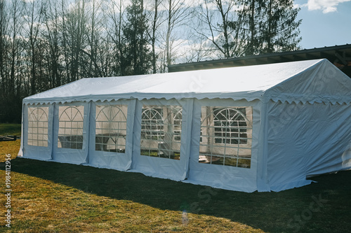 White Event Tent on Lawn for Outdoor Wedding or Corporate Event