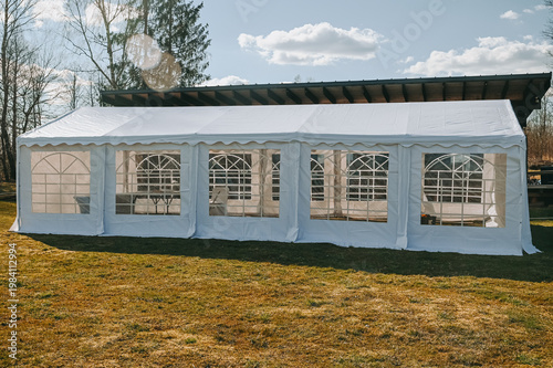 White Marquee Event Tent on Lawn for Outdoor Weddings and Events