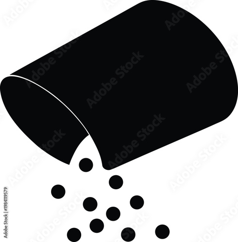 Black container tipping spilling circular objects a striking silhouette high quality