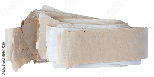 Stack of old torn long paper strip sheets folded with rough edges isolated on white