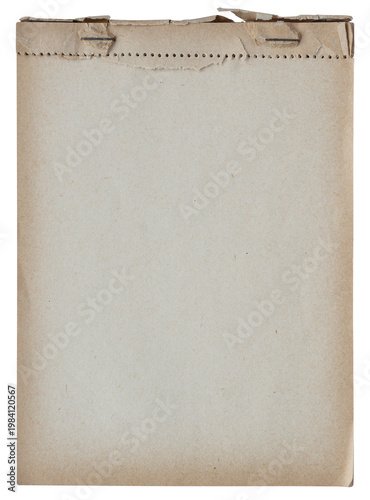 Old notebook page with perforation holes and torn ripped edges on aged paper isolated on white background