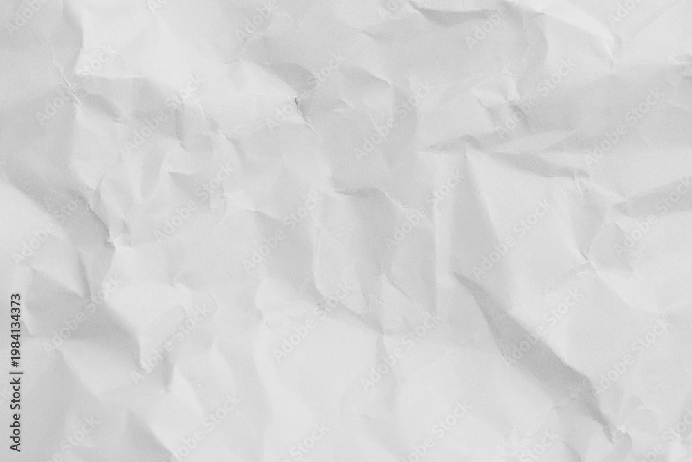 Obraz premium Top view of white crumpled paper texture background,Macro,Close-up shot of white wrinkled and crumpled paper texture background. High resolution texture of folded paper with shadows and highlights,