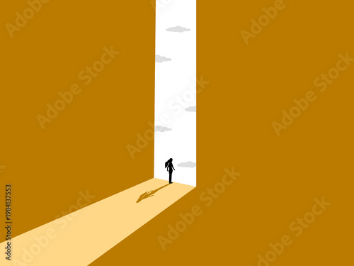 businesswoman stood looking out the large window