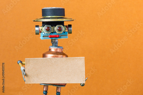 Robot with hat, copper torso and wide smile holding empty cardboard sign with copy space. Announcement template concept, promotional poster